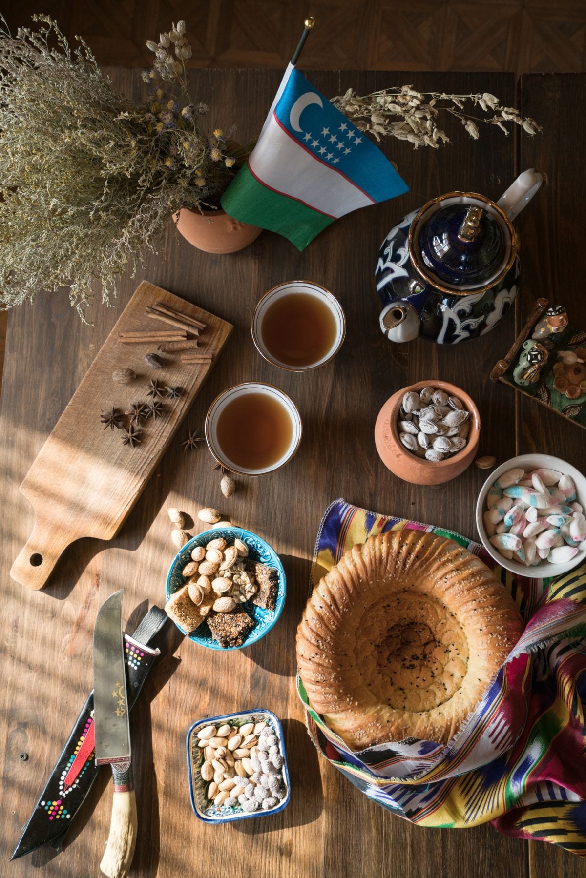 Tea, bread and traditional ceramics on an Uzbek table
